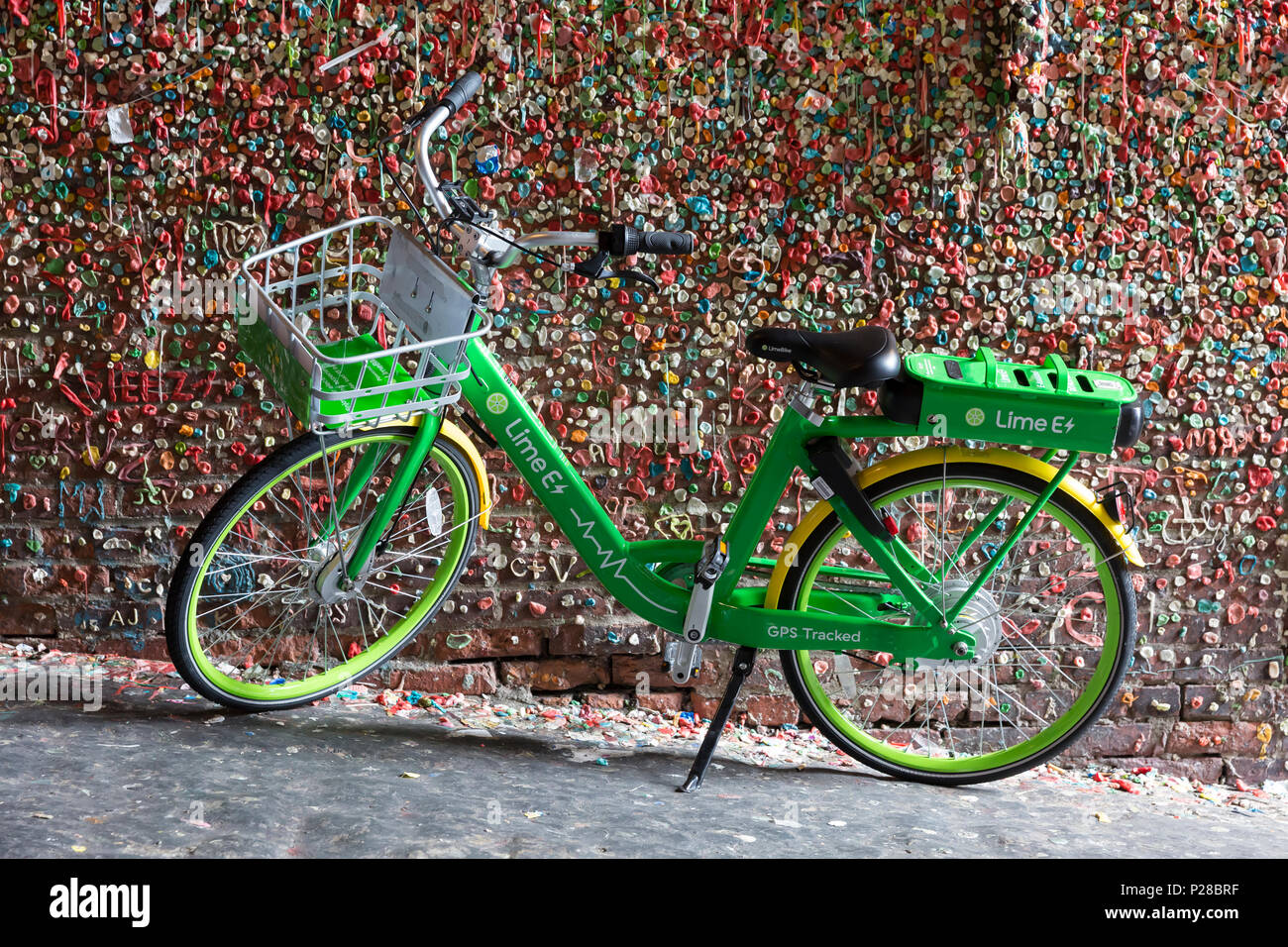 Seattle, Washington: LimeBike electric bicycle parked at Pike Place Market's famous gum wall. Currently active in 8 US cities, the bicycle sharing com Stock Photo