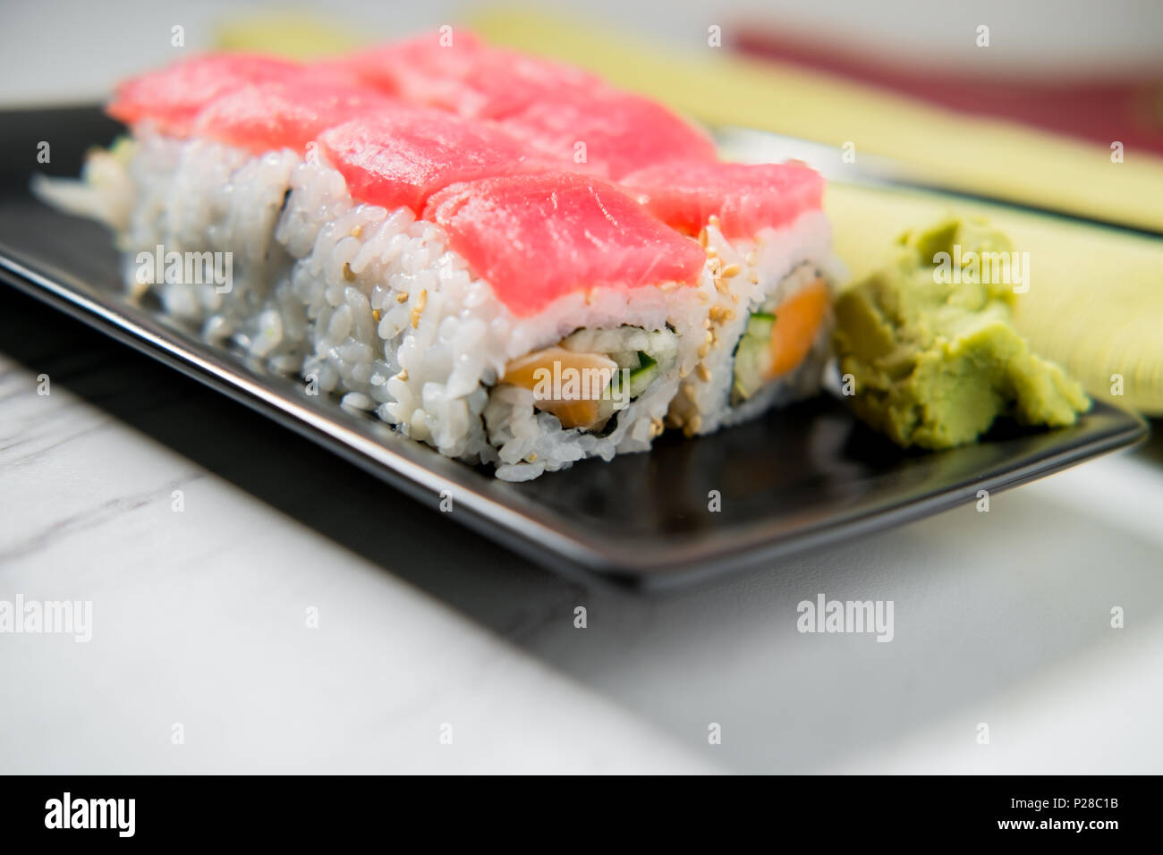 Japanese tuna salmon and cucumber sushi roll with wasabi and pickled ginger Stock Photo