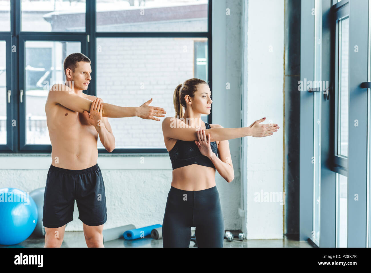 Young athletes stretching before workout hi-res stock photography and ...