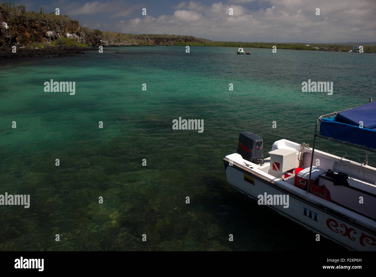 Boat floating in clear water Stock Photo - Alamy
