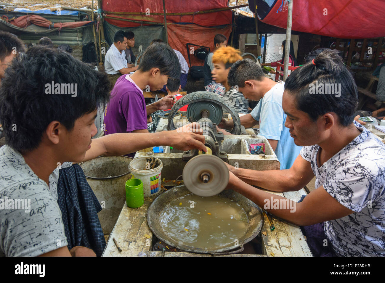 Mandalay, Jade Market, men polish polishing jade stones, Mandalay