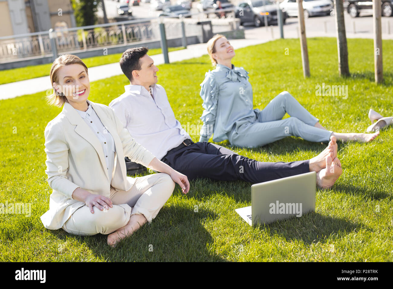 Three managers working outside on summer day Stock Photo - Alamy