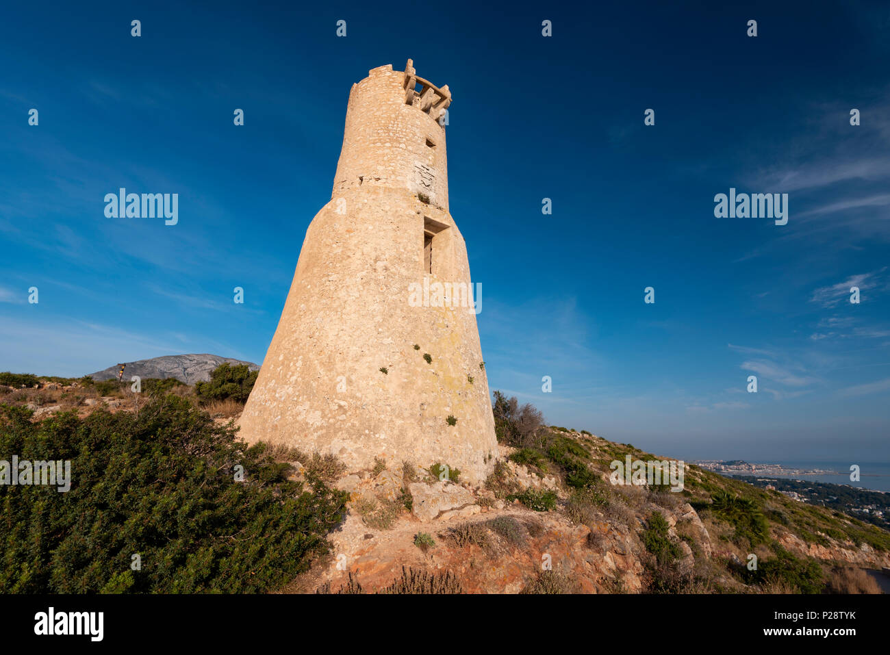 Tower del Gerro in the area of Les Rotes is part of the network of fortifications built along the coast during the 16th century to prevent constant in Stock Photo