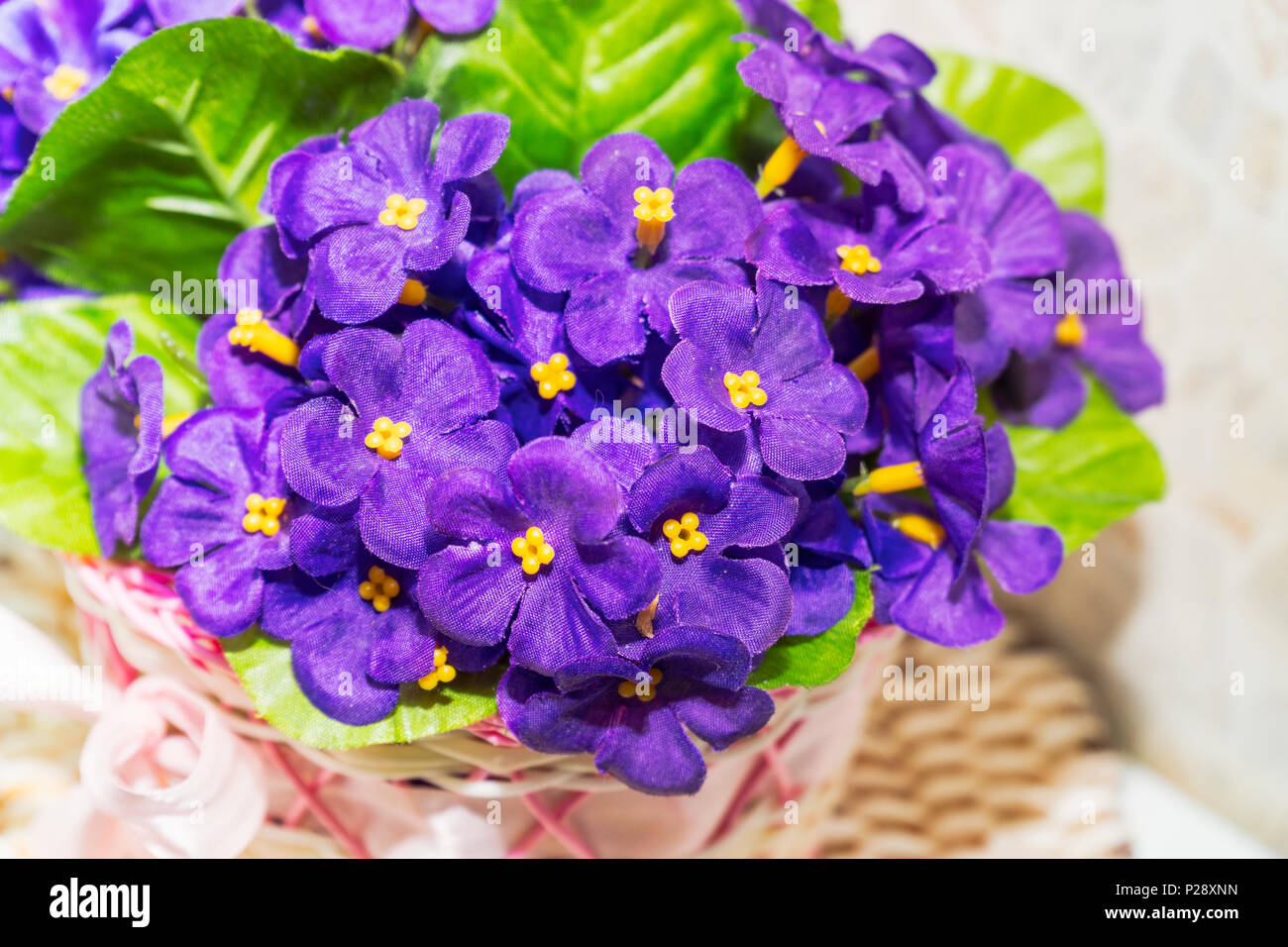 Beautiful bouquet of artificial lilac violets Stock Photo Alamy