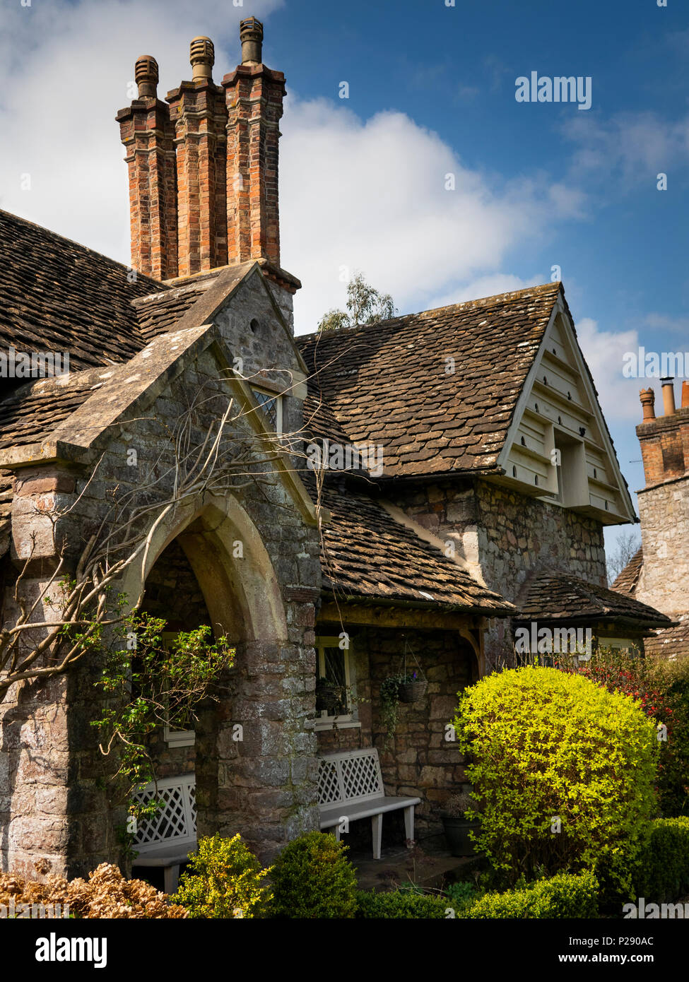 UK, England, Bristol, Henbury, Blaize Hamlet, estate cottage with stone roof and dovecote in