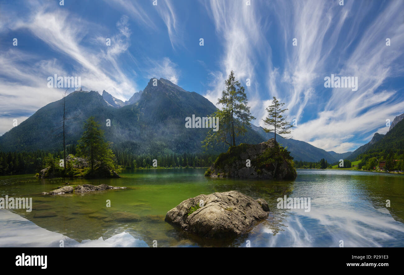 Hochkalter mountain group in the bavarian alps, viewed from the famous Hintersee lake, with feather clouds in the summer Stock Photo