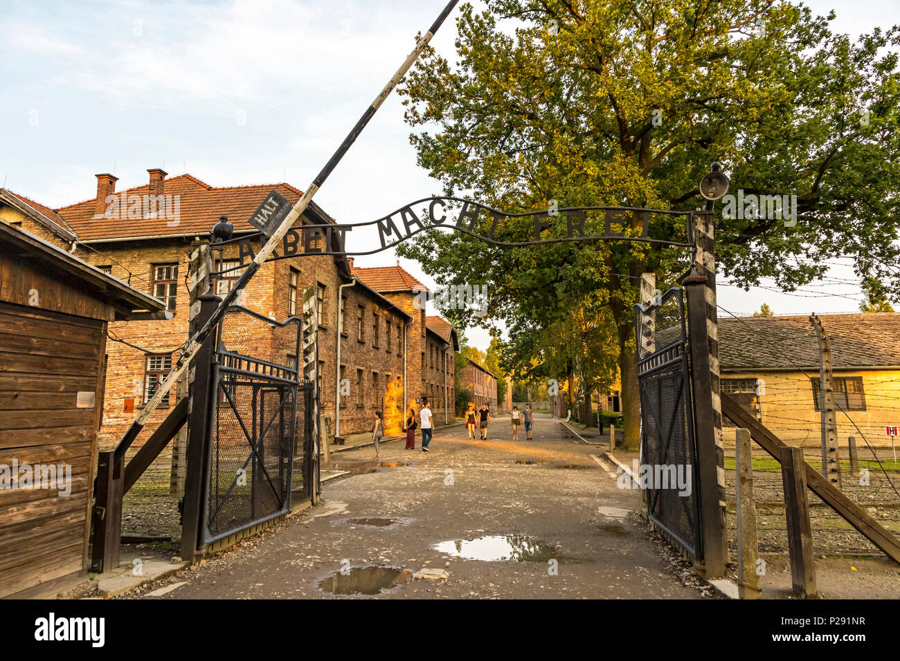 AUSCHWITZ, POLAND - AUGUST 27, 2017. Arbeit macht frei sign on the main entrance gateway to Auschwitz-Birkenau (Auschwitz I) concentration camp near O Stock Photo