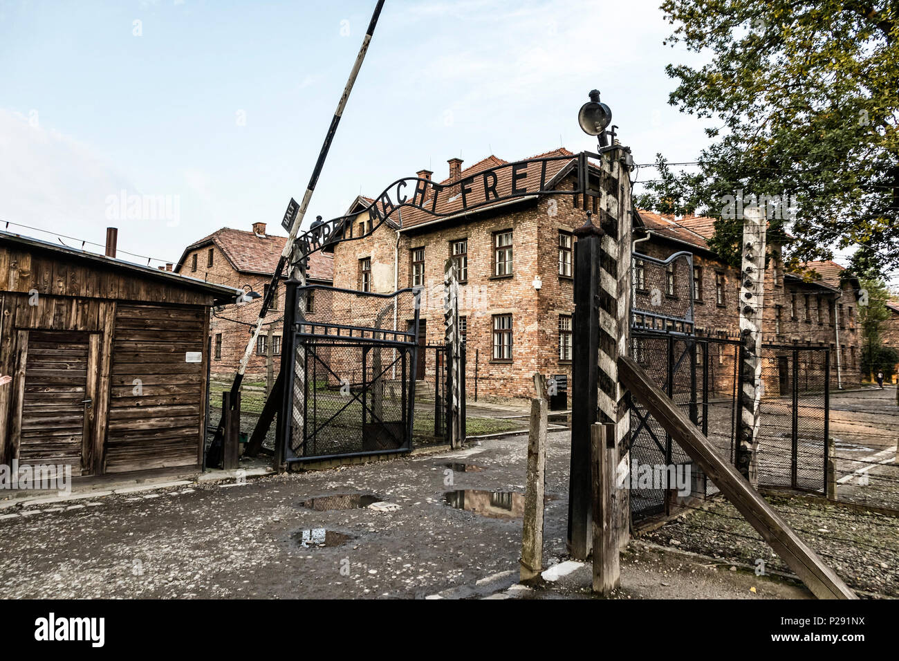 'Arbeit macht frei' sign on the main entrance gateway to Auschwitz-Birkenau (Auschwitz I) concentration camp near Oswiecim city, Poland. This German p Stock Photo