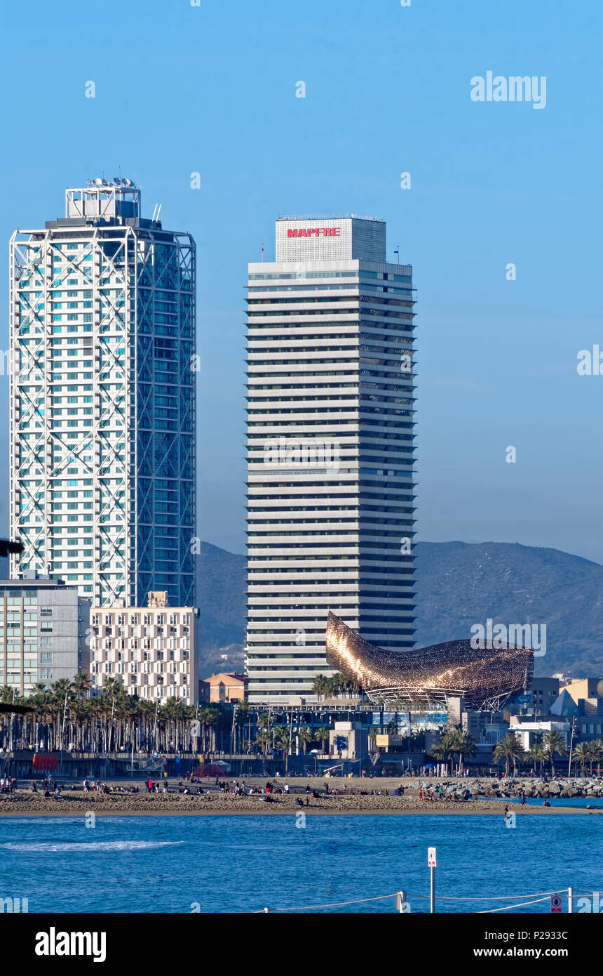 Barcelona, Spain - March 27, 2015: View on the beach and buildings in Port Olympic. Stock Photo