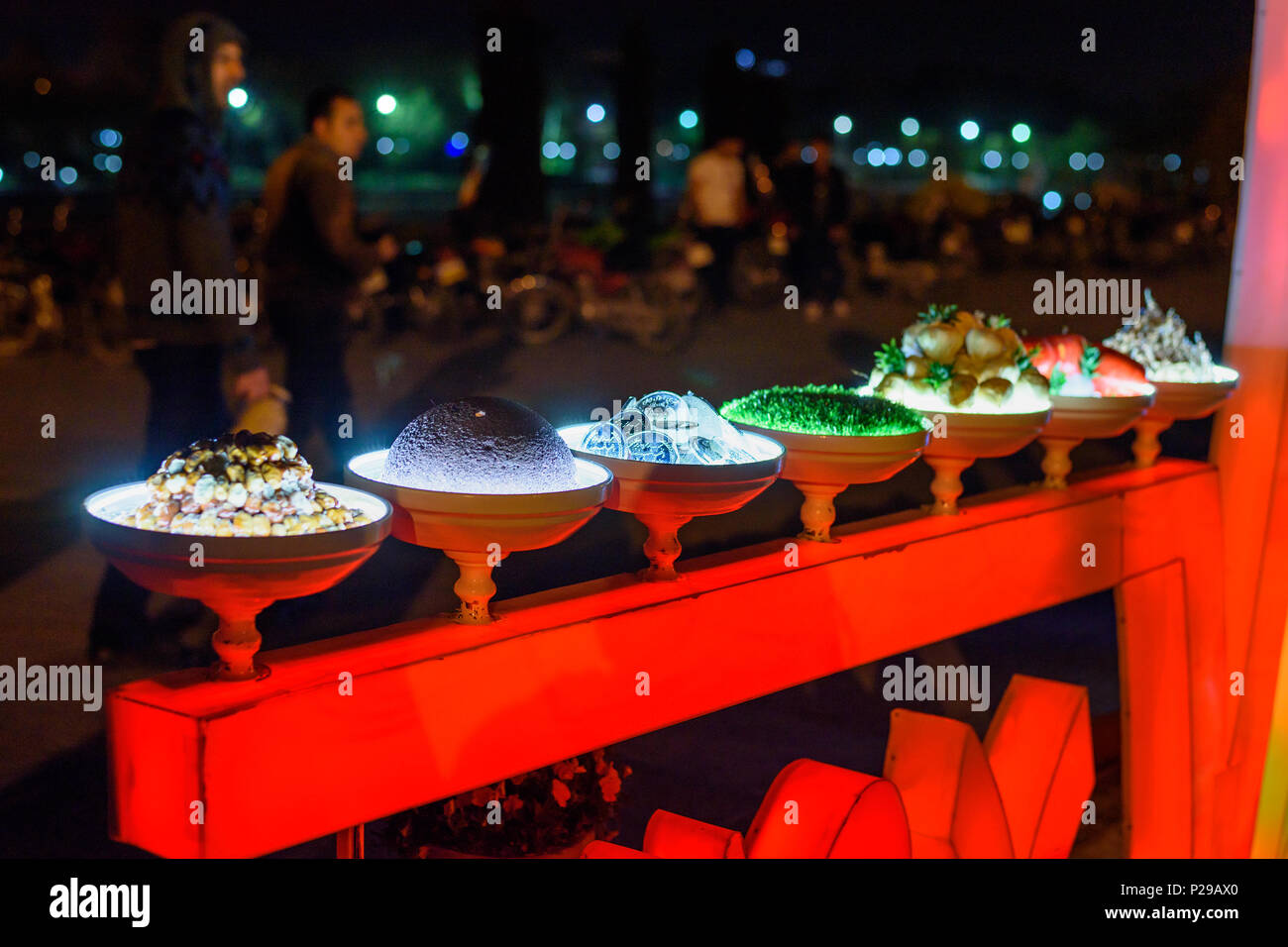 Isfahan, Iran - March 20, 2018: Nowruz decorations traditional Haft-seen on the street at night Stock Photo