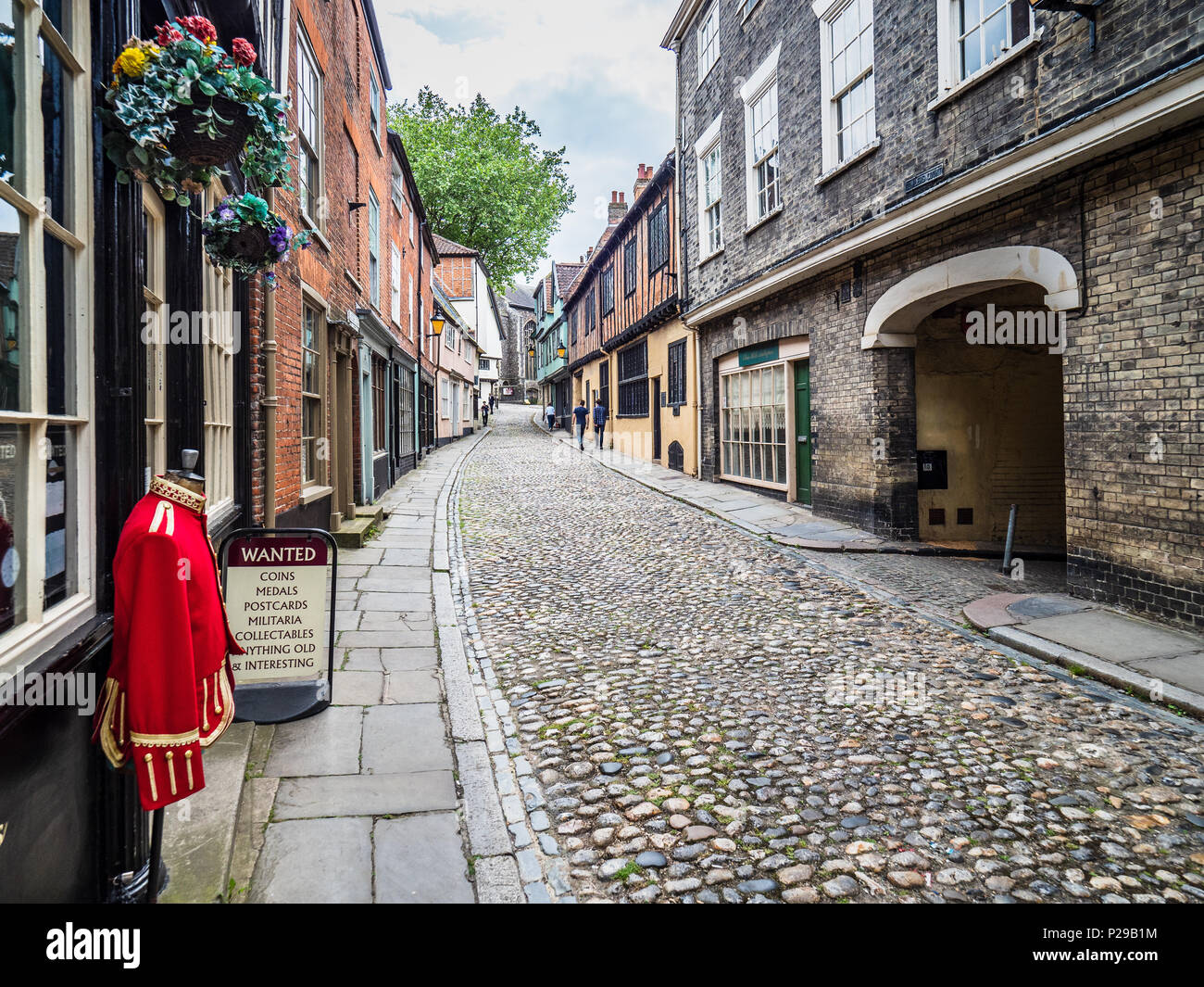 Elm Hill Norwich - a historic cobbled lane in central Norwich, UK. The street contains a number of historic buildings dating back to Tudor times. Stock Photo