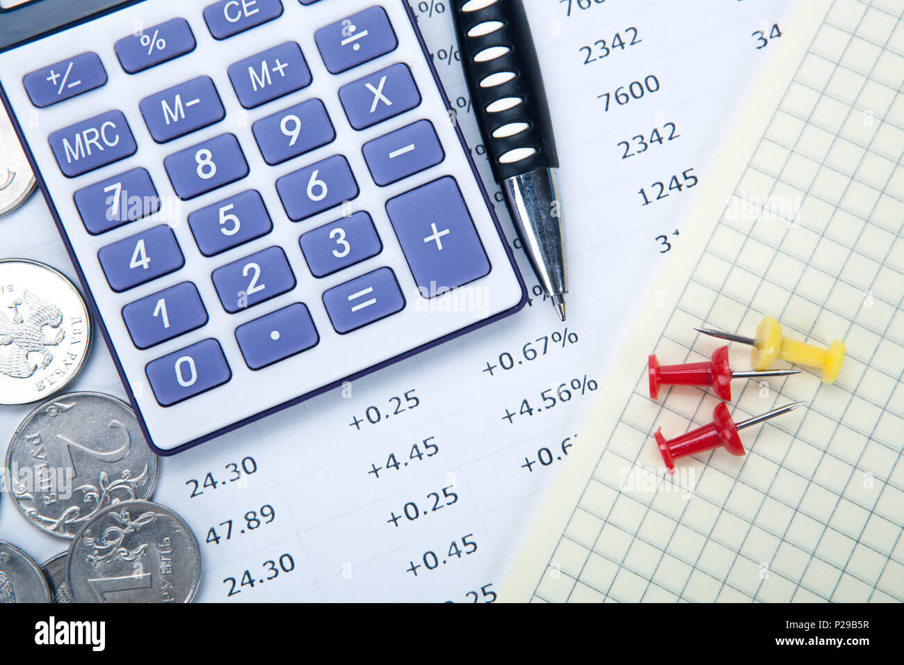 Russian rubles with calculator and a pen and digits closeup Stock Photo ...