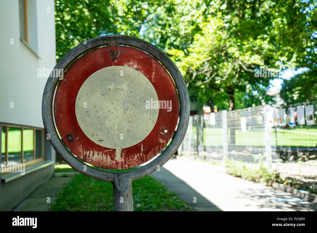old washed out no trespassing sign with trees in the back Stock Photo ...