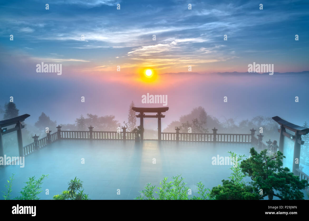 The magical dawn on the pagoda, surrounded by dew and magical light from the beautiful sun to meditate and relax the soul Stock Photo