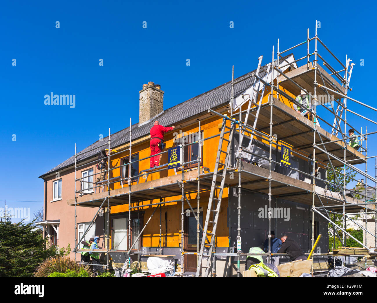 dh Heating Wall insulation BUILDING UK External thermal insulating exterior foam facade outside house walls home installation retrofit Stock Photo