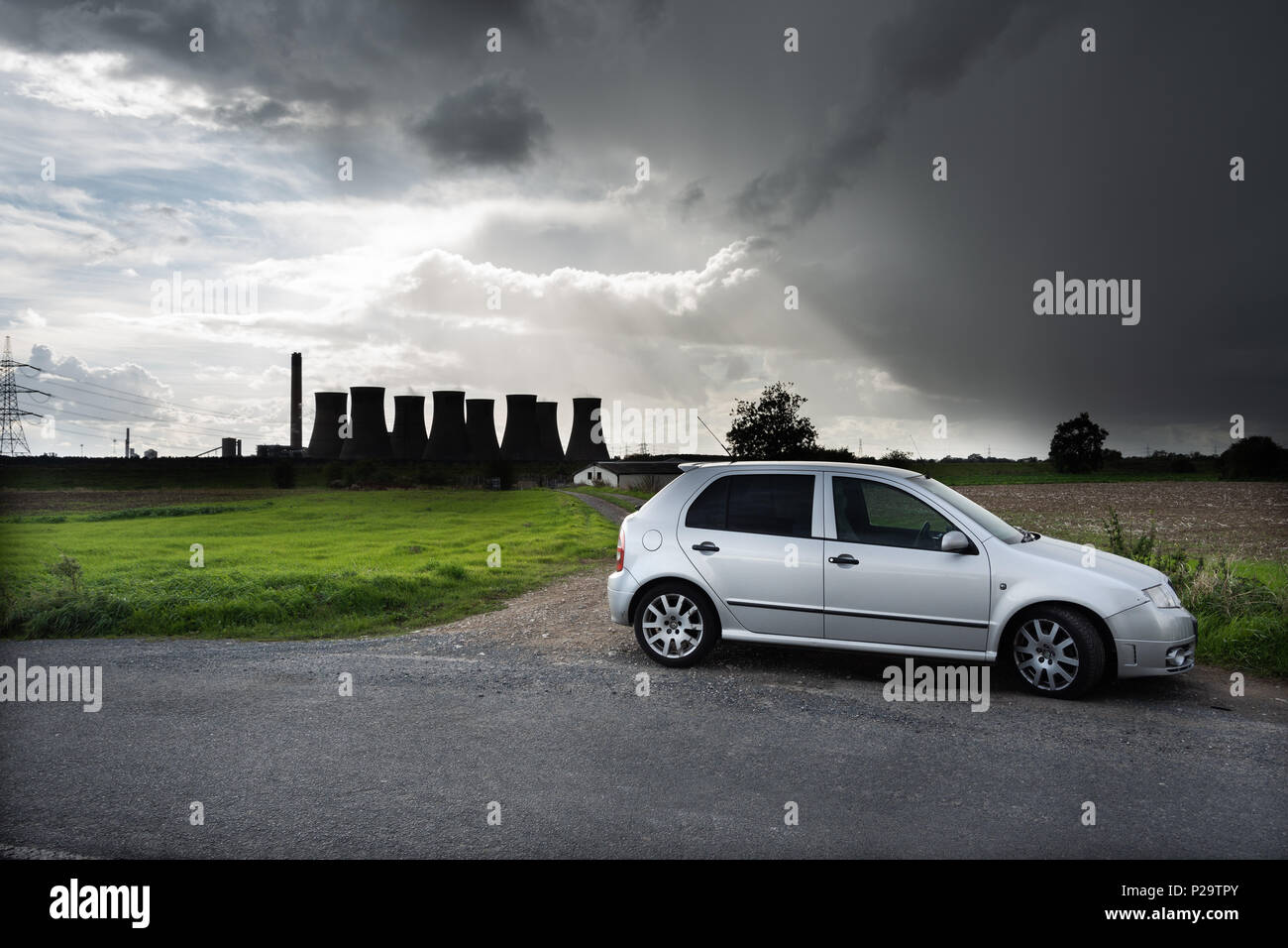 Skoda Fabia VRS in from of Eggborough power station under a stormy sky Stock Photo