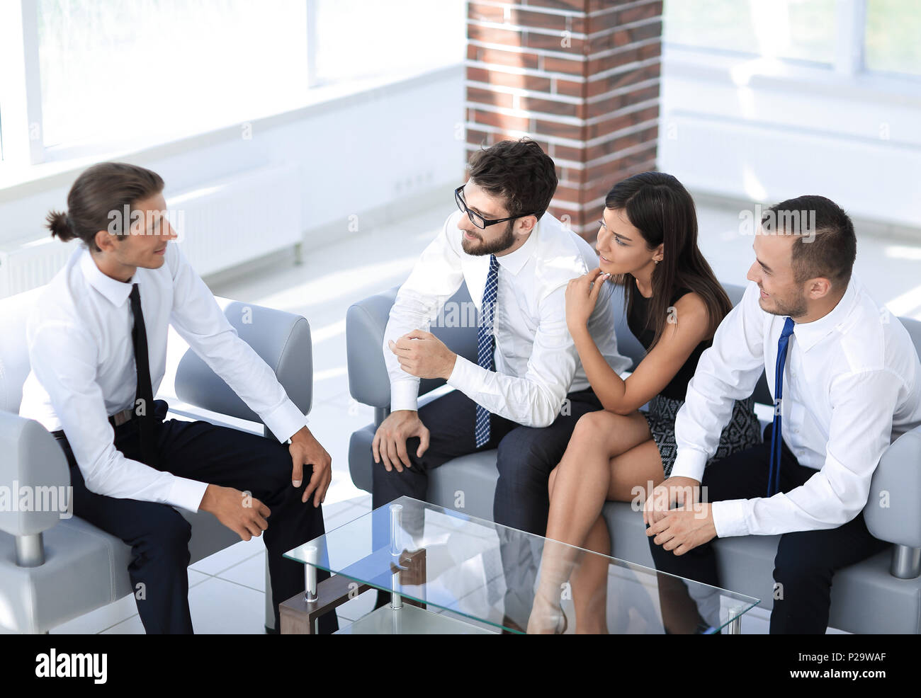 employees sitting in the lobby of the office Stock Photo - Alamy