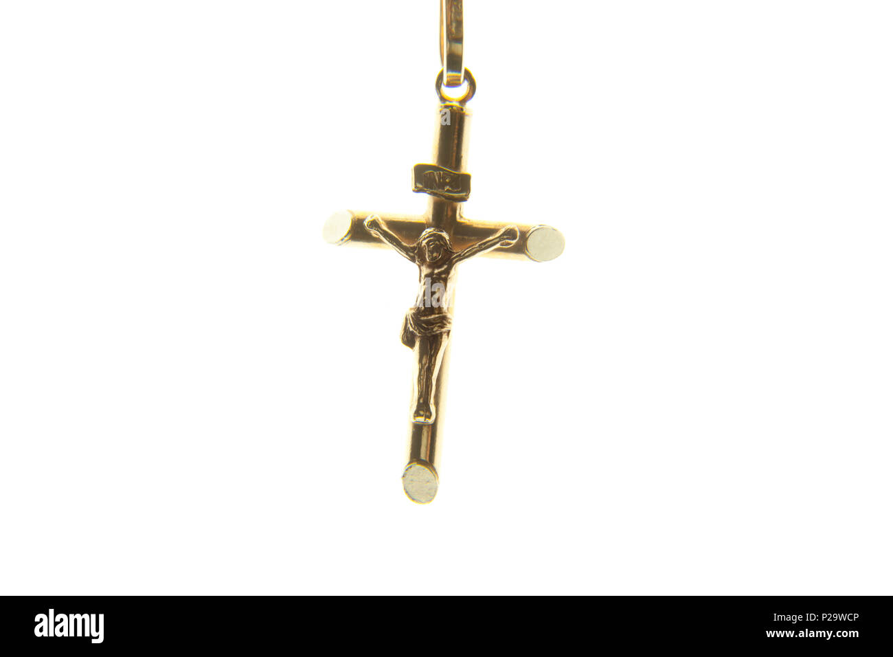 A jewel representing Jesus Christ on the cross, isolated on white background. Stock Photo