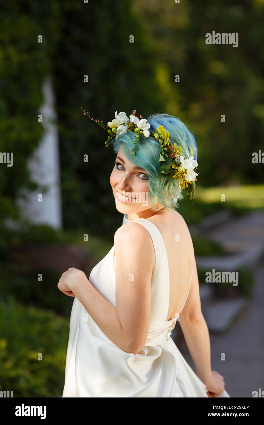 Portrait Of A Beautiful Bride With Blue Hair And A Wreath Of Real