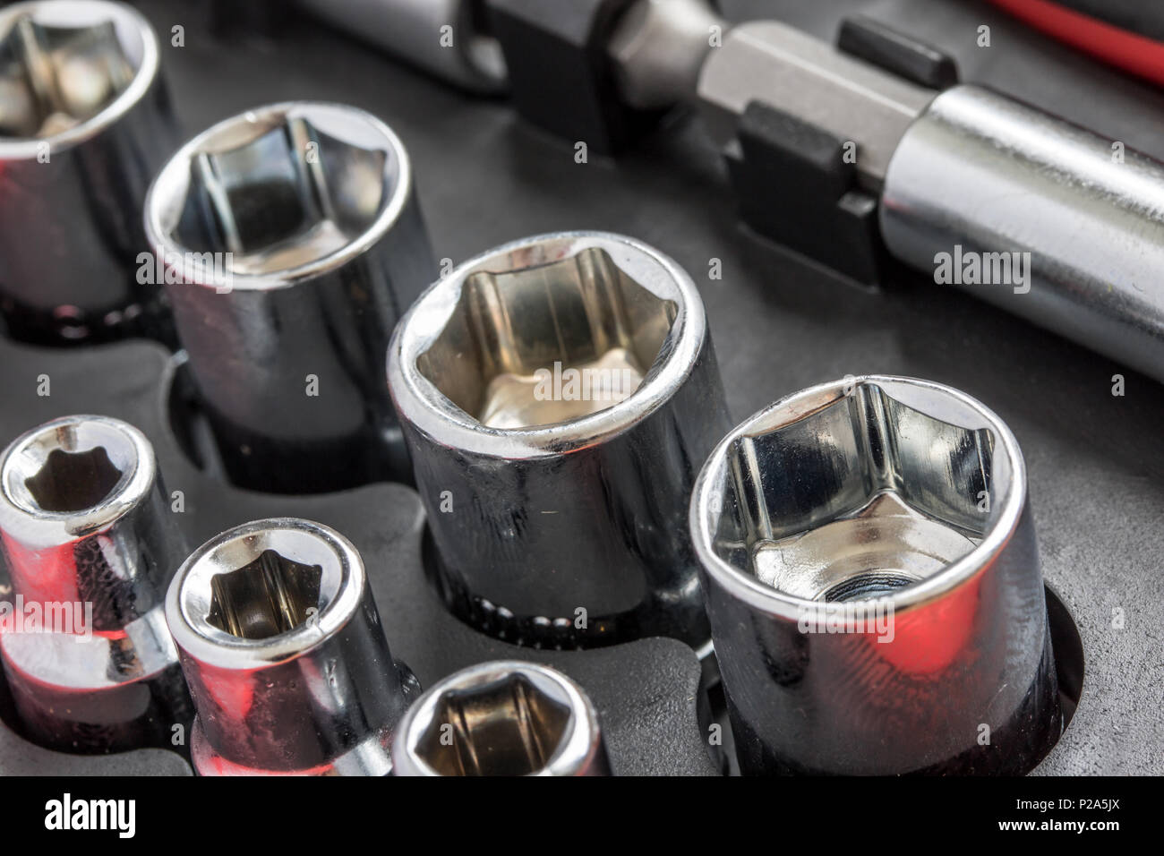 A set of metal heads for keys of different sizes in box for tools ...