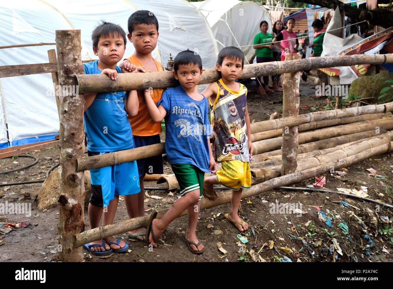 Christian IDP refugees in a tent camp on the outskirts of the ruined city Marawi, Mindanao Island, Philippines - Christliche Flüchtlinge in einem Zeltlager der zerstörten Stadt Marawi in einem Zeltlager am Rande der Stadt. Insel Mindanao, Philippinen Stock Photo