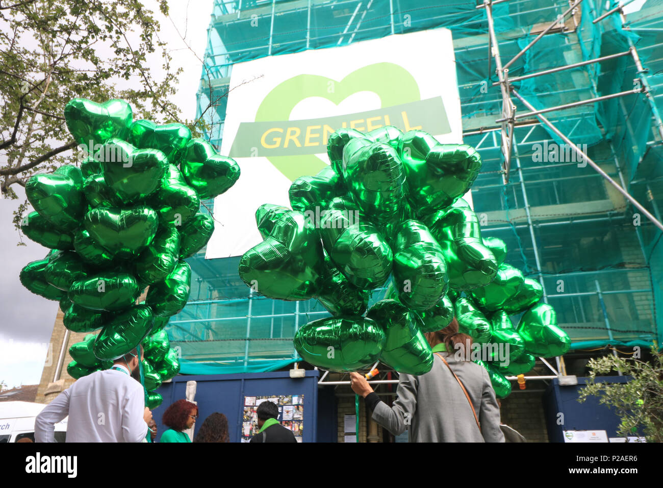 London UK. 14th June 2018. Green ballons to mark the Grenfell anniversary a year after the fire  in West London which claimed the lives of 72 residents in the tower block.  A minute's silence will be observed nationally at midday to remember the victims of the Grenfell fire on 14 June 2017. Credit: amer ghazzal/Alamy Live News Stock Photo