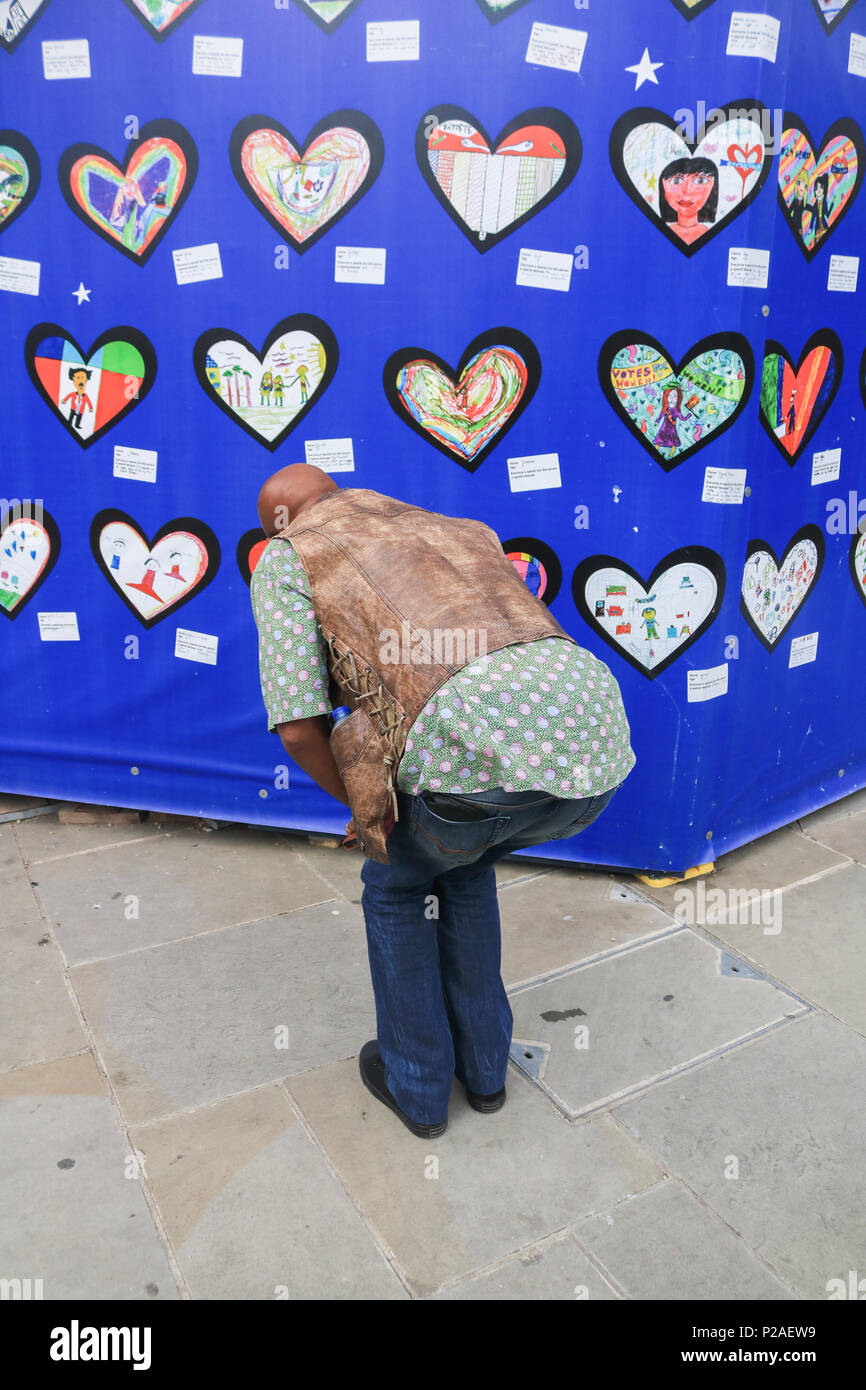 London UK. 14th June 2018.  A mural with hearts with the names of the Grenfell fire victims  on the One Year anniversary after the fire  in West London which claimed the lives of 72 residents in the tower block.  A minute's silence will be observed nationally at midday to remember the victims of the Grenfell fire on 14 June 2017. Credit: amer ghazzal/Alamy Live News Stock Photo