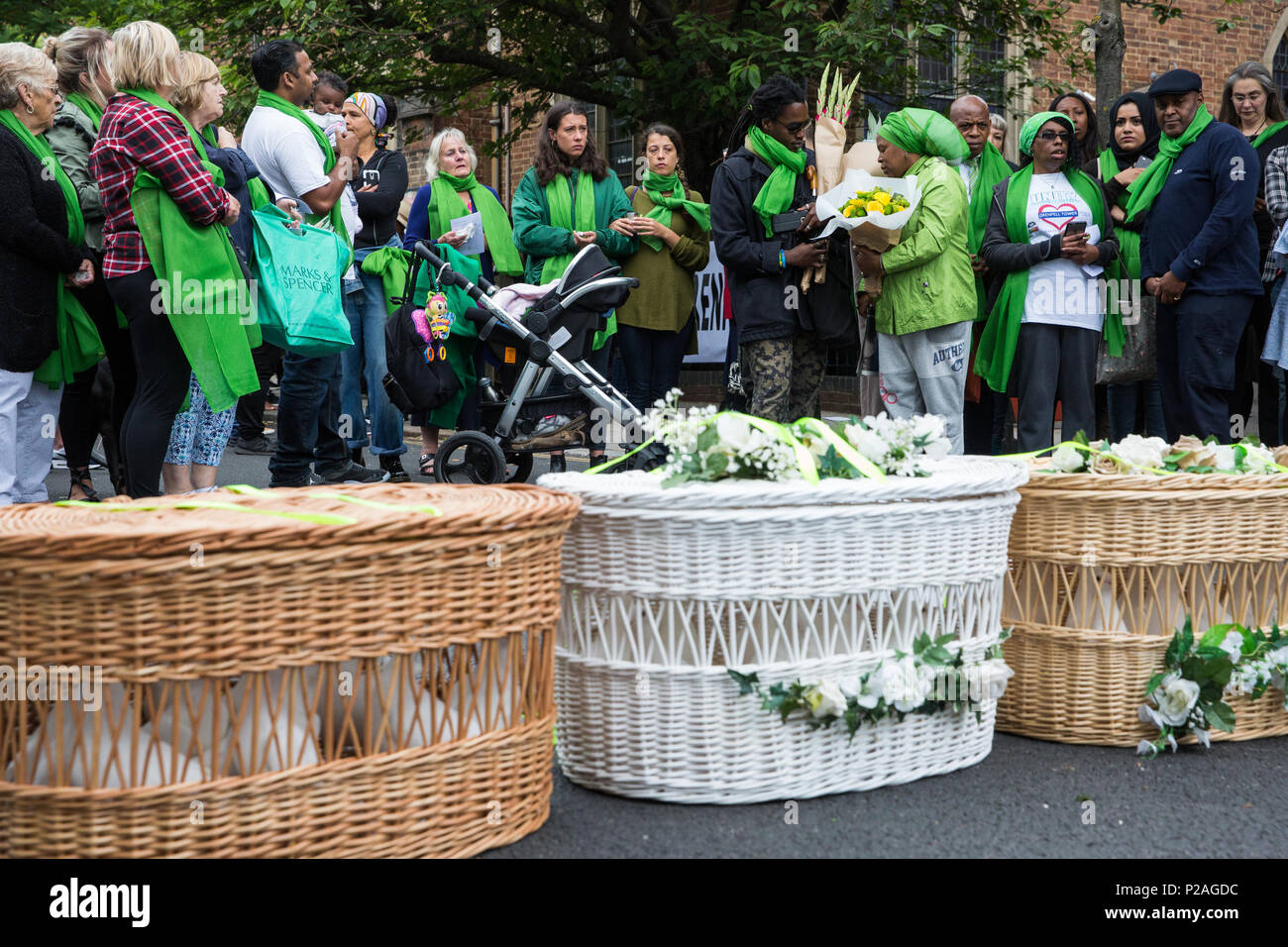 London, UK. 14th June, 2018. Family members prepare to release doves of peace outside St Helen's Church to mark the first anniversary of the Grenfell Tower Fire. Credit: Mark Kerrison/Alamy Live News Stock Photo