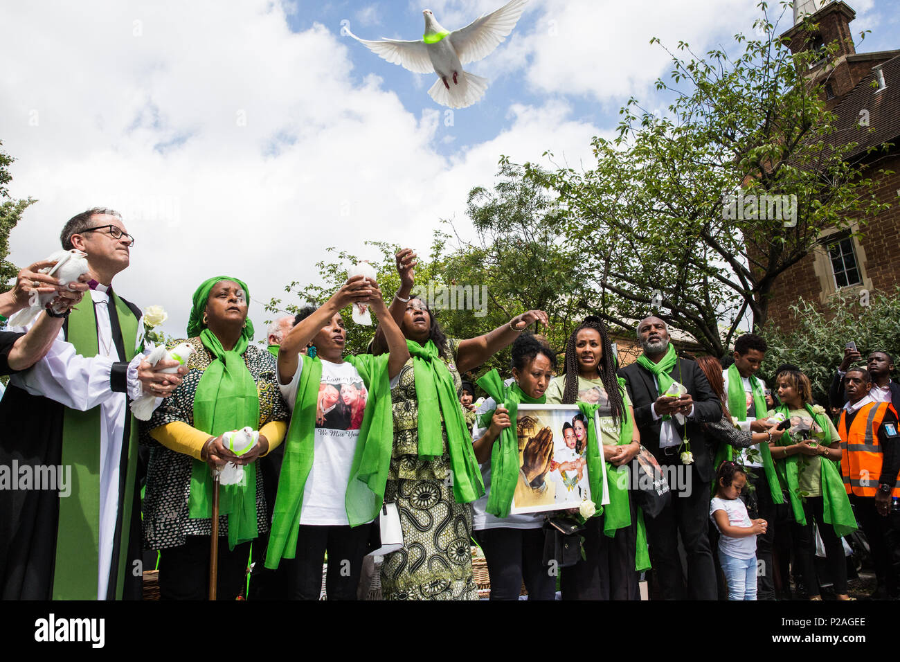London, UK. 14th June, 2018. Family members release doves of peace outside St Helen's Church to mark the first anniversary of the Grenfell Tower Fire. Credit: Mark Kerrison/Alamy Live News Stock Photo