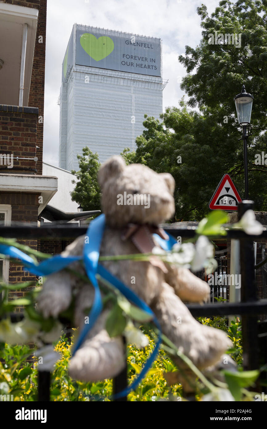 London, UK. 14th Jun, 2018.  Childrens' bears and cuddly toys on railings near where the Grenfell fire occured, on the first anniversary of the tower block disaster. 72 people died when the tower block in the borough of Kensington & Chelsea were killed in what has been called the largest fire since WW2. The 24-storey Grenfell Tower block of public housing flats in North Kensington, West London, United Kingdom. It caused 72 deaths, out of the 293 people in the building, including 2 who escaped and died in hospital. Over 70 were injured and left traumatised. Credit: RichardBaker/Alamy Live News Stock Photo