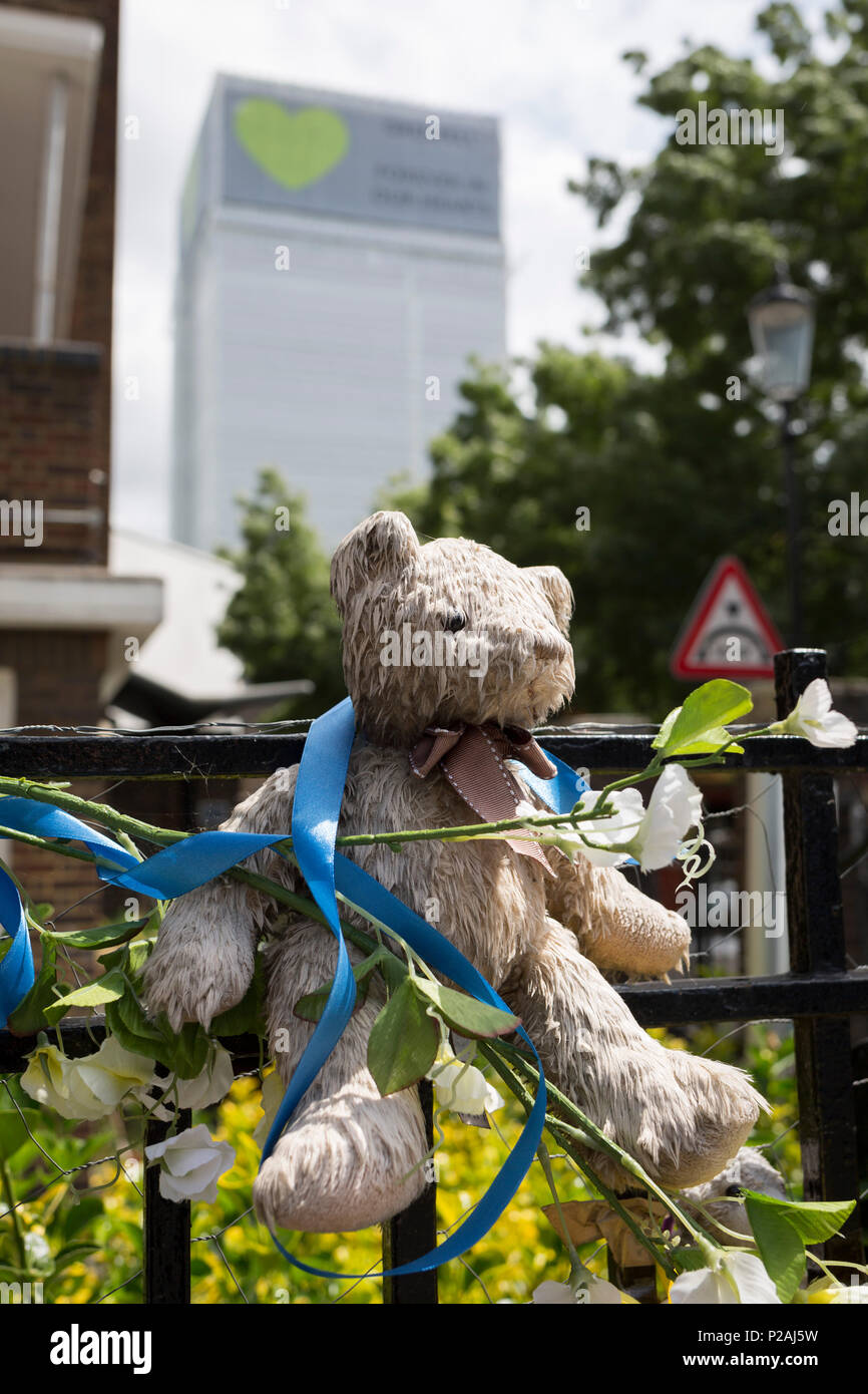 London, UK. 14th Jun, 2018.  Childrens' bears and cuddly toys on railings near where the Grenfell fire occured, on the first anniversary of the tower block disaster. 72 people died when the tower block in the borough of Kensington & Chelsea were killed in what has been called the largest fire since WW2. The 24-storey Grenfell Tower block of public housing flats in North Kensington, West London, United Kingdom. It caused 72 deaths, out of the 293 people in the building, including 2 who escaped and died in hospital. Over 70 were injured and left traumatised. Credit: RichardBaker/Alamy Live News Stock Photo