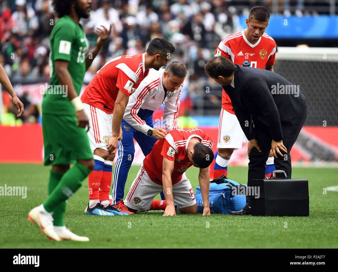 Moscow, Russia. 14th June, 2018. Moscow, Russia. 14th June, 2018. Soccer; FIFA World Cup, First Round, Group A, First Matchday, Russia vs. Saudi Arabia at the Luzhniki Stadium: Alan Dsagojew from Russia kneels due to an injury. Photo: Federico Gambarini/dpa Credit: dpa picture alliance/Alamy Live News Credit: dpa picture alliance/Alamy Live News Stock Photo