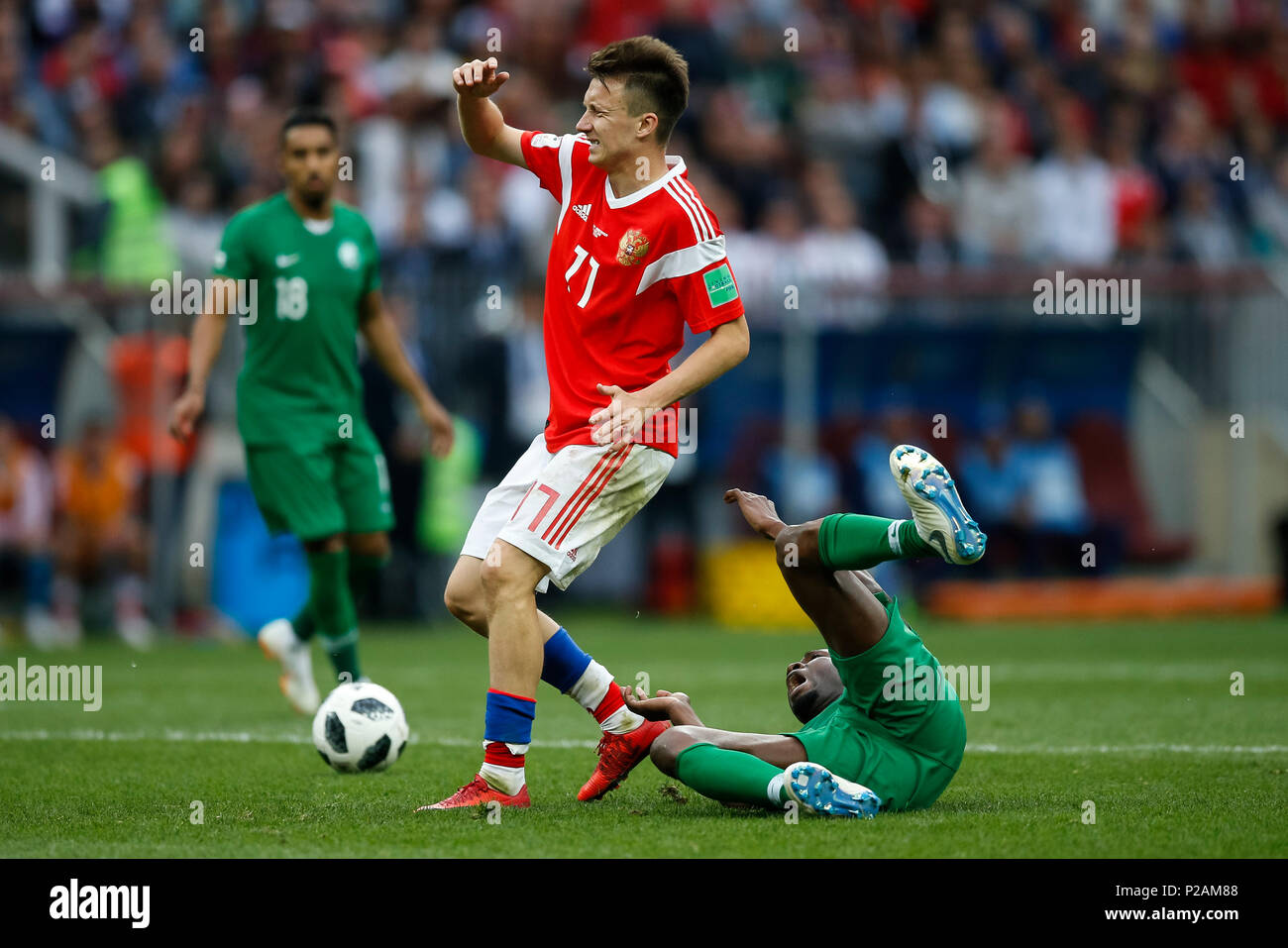 Moscow, Russia. 14th June 2018. Mohammed Al-Breik of Saudi Arabia is fouled by Aleksandr Golovin of Russia during the 2018 FIFA World Cup Group A match between Russia and Saudi Arabia at Luzhniki Stadium on June 14th 2018 in Moscow, Russia. Credit: PHC Images/Alamy Live News Stock Photo
