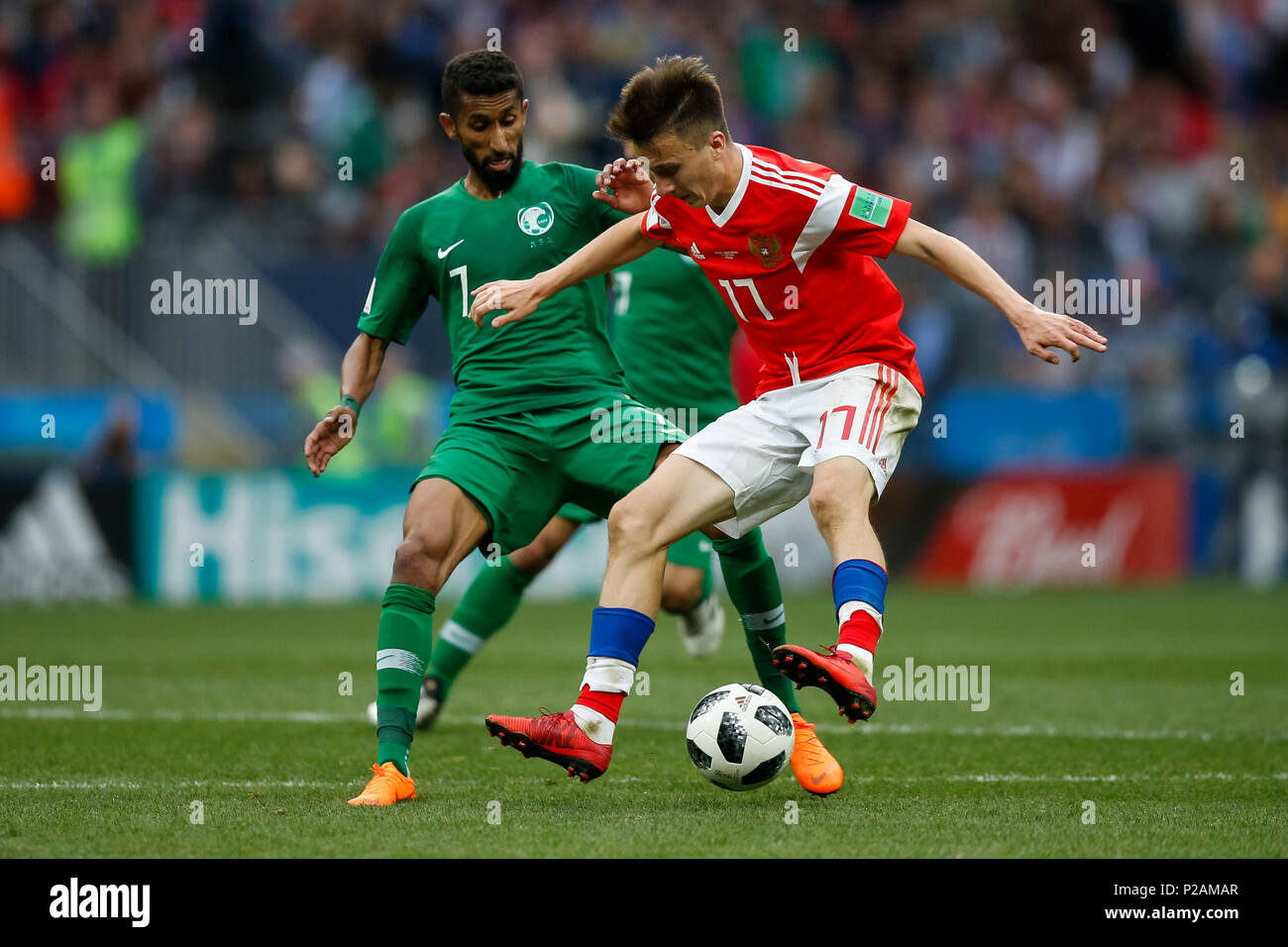 Moscow, Russia. 14th June 2018. Salman Al-Faraj of Saudi Arabia and Aleksandr Golovin of Russia during the 2018 FIFA World Cup Group A match between Russia and Saudi Arabia at Luzhniki Stadium on June 14th 2018 in Moscow, Russia. Credit: PHC Images/Alamy Live News Stock Photo