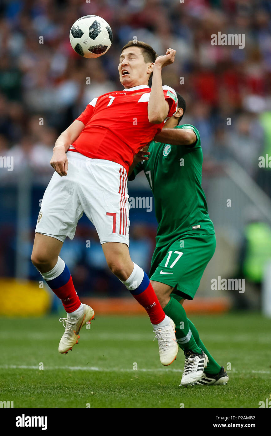 Moscow, Russia. 14th June 2018. Daler Kuzyayev of Russia and Taisir Al-Jassim of Saudi Arabia during the 2018 FIFA World Cup Group A match between Russia and Saudi Arabia at Luzhniki Stadium on June 14th 2018 in Moscow, Russia. Credit: PHC Images/Alamy Live News Stock Photo