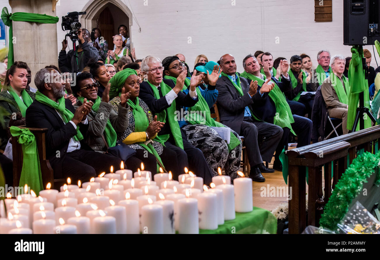 The congregation applauds at the service to mark the one year anniversary of the Grenfell Fire, St Helen's Church, North Kensington, London, England, UK, 14th June, 2018 Stock Photo