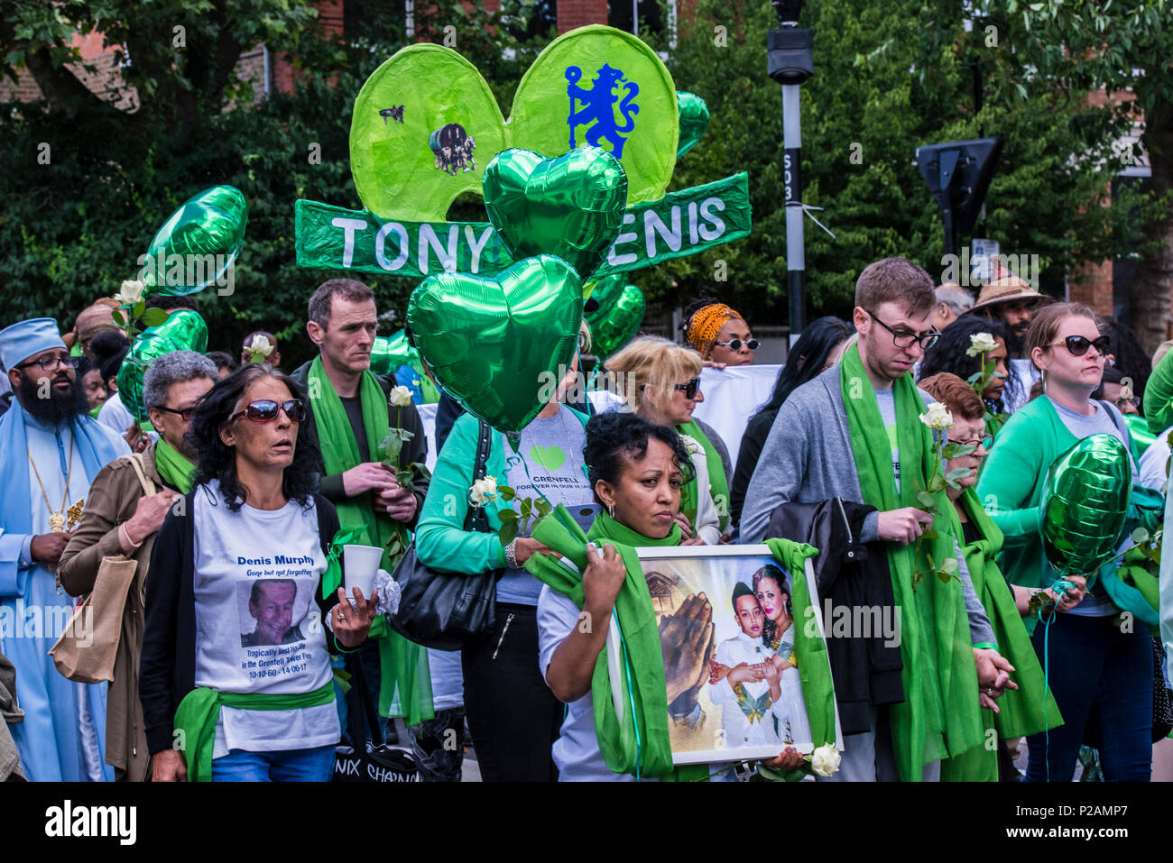 Friends and family members walk towards Grenfell Tower, to mark the one year anniversary of the fire, London, England, UK, 14th June 2018 Stock Photo