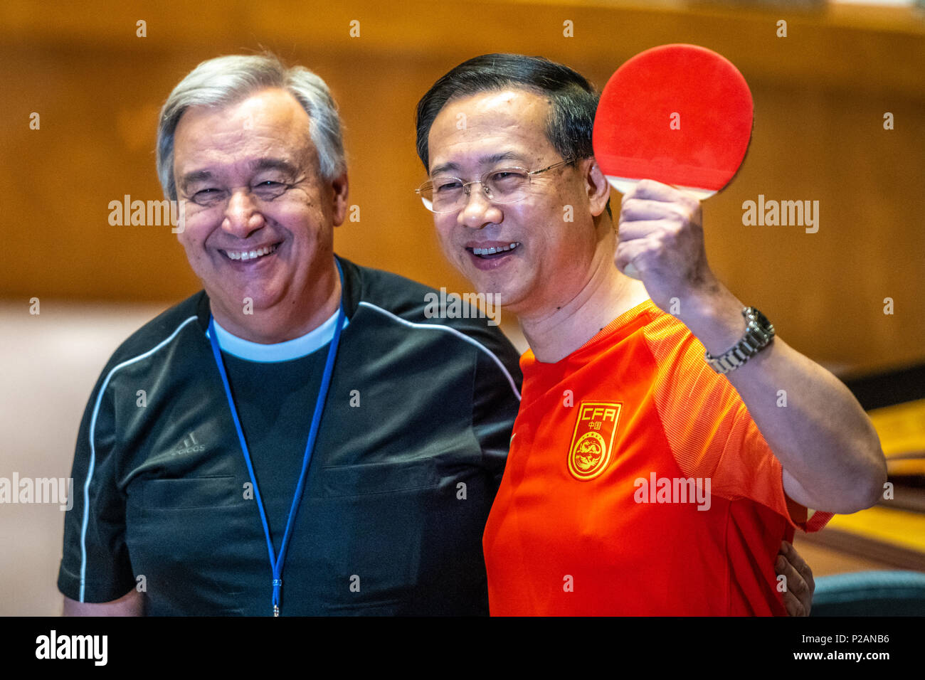 New York, USA, 14 June 2018. United Nations Secretary-General António Guterres wears a referee jersey as China's Security Council member Ma Zhaoxu wears his team's soccer jersey and holds a table tennis racket  to mark the opening day of the 2018 FIFA World Cup, being hosted by the Russian Federation from 14 June to 15 July. Credit: Enrique Shore/Alamy Live News Stock Photo