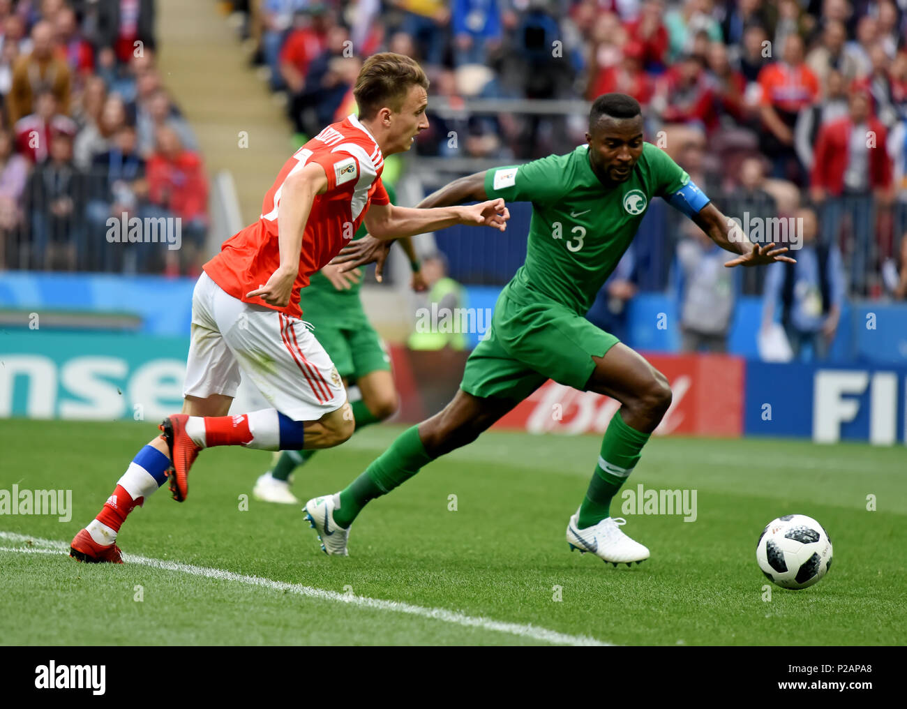 Moscow, Russia - June 14, 2018. Saudi Arabian defender Osama Hawsawi against Russian midfielder Aleksandr Golovin in the opening match of FIFA World Cup 2018 Russia vs Saudi Arabia. Credit: Alizada Studios/Alamy Live News Stock Photo