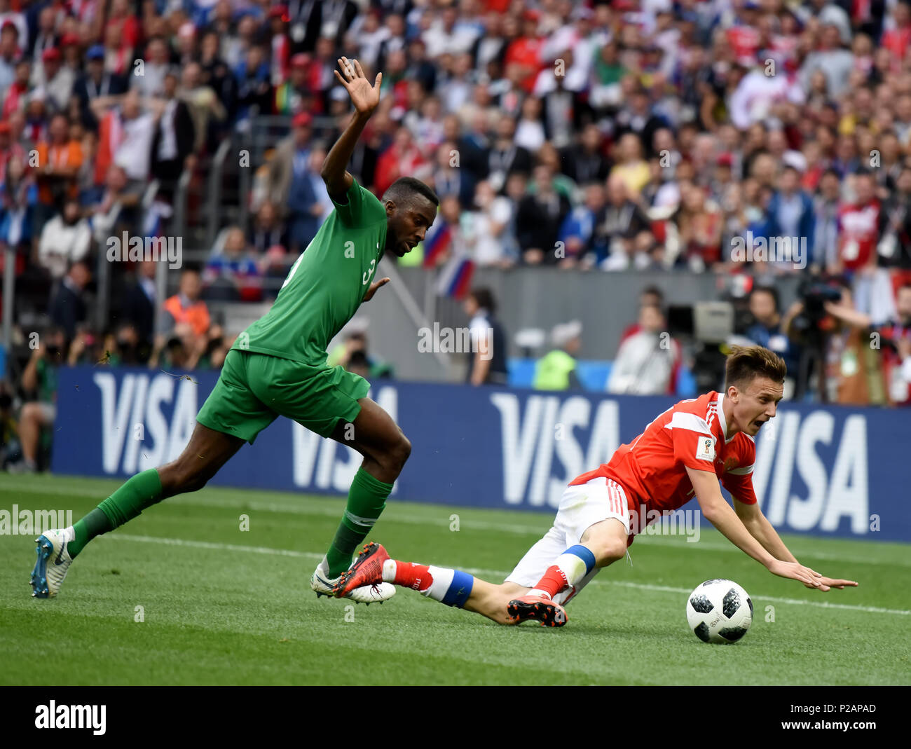 Moscow, Russia - June 14, 2018. Saudi Arabian defender Osama Hawsawi against Russian midfielder Aleksandr Golovin in the opening match of FIFA World Cup 2018 Russia vs Saudi Arabia. Credit: Alizada Studios/Alamy Live News Stock Photo