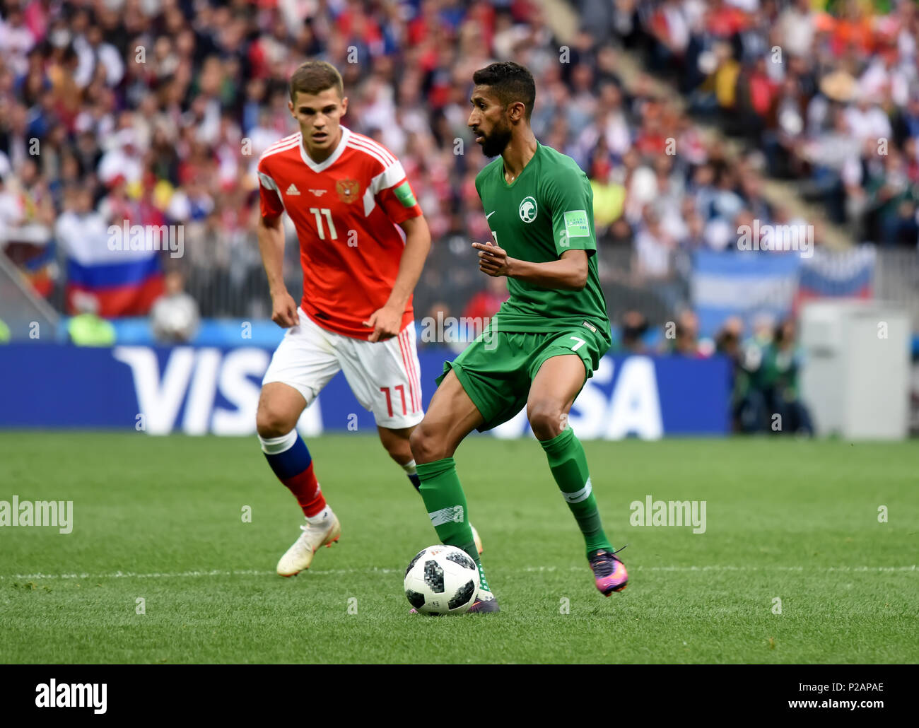 Moscow, Russia - June 14, 2018. Saudi Arabian midfielder Salman Alfaraj against Russian midfielder Roman Zobnin in the opening match of FIFA World Cup 2018 Russia vs Saudi Arabia. Credit: Alizada Studios/Alamy Live News Stock Photo