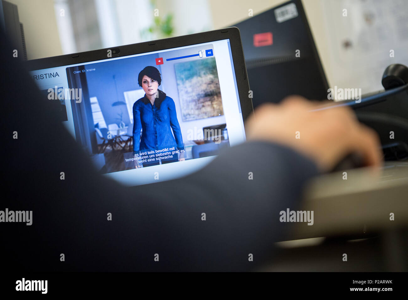 17 April 2018, Germany, Tuebingen: A woman operating the care avatar Kristina. Nursing staff from abroad or the elderly with migrant backgrounds: they find it hard to communicate and need help in the German care jungle. Tuebingen experts have developed an intelligent assistant. Photo: Sebastian Gollnow/dpa Stock Photo