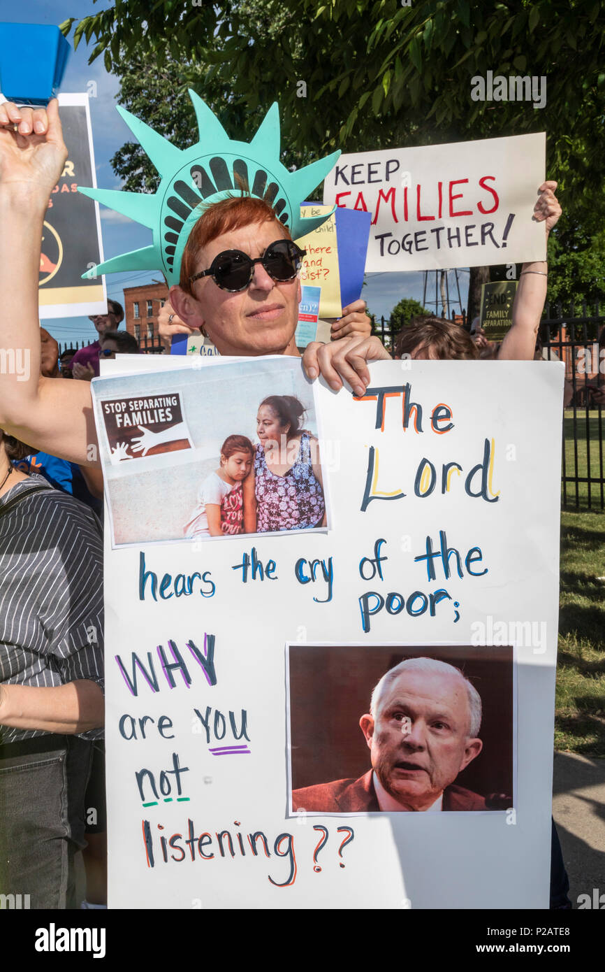 Detroit, Michigan USA - 14 June 2018 - Protesters oppose the Trump administration's policy of separating young children from their parents at the U.S.-Mexico border. Lining the street outside the Immigration and Customs Enforcement detention center, the group was part of nationwide protests in many cities organized by Families Belong Together. Credit: Jim West/Alamy Live News Stock Photo