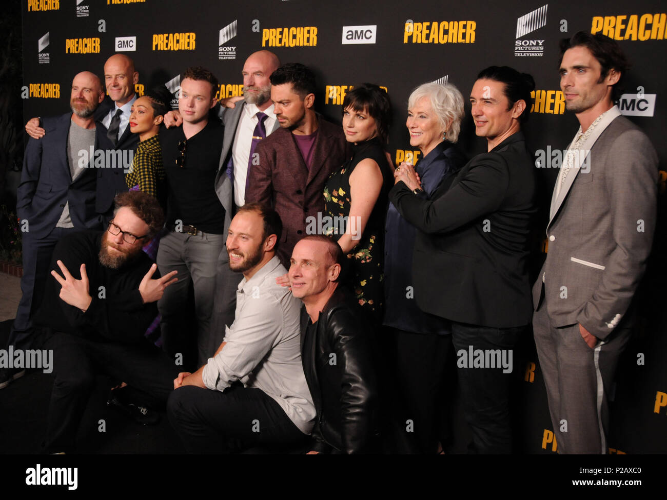 LOS ANGELES, CA - JUNE 14: (L-R) Actor Pip Torrens, actress Ruth Negga, actors Ian Colletti, Graham McTavish, Dominic Cooper, Julie Ann Emery, Betty Buckley, Adam Croasdell, Tyson Ritter and Colin Cunningham and executive producers Seth Rogen and Evan Goldberg (front)  attend AMC's 'Preacher' Season 3 Premiere Party on June 14, 2018 at The Hearth and Hound in Los Angeles, California. Photo by Barry King/Alamy Live News Stock Photo
