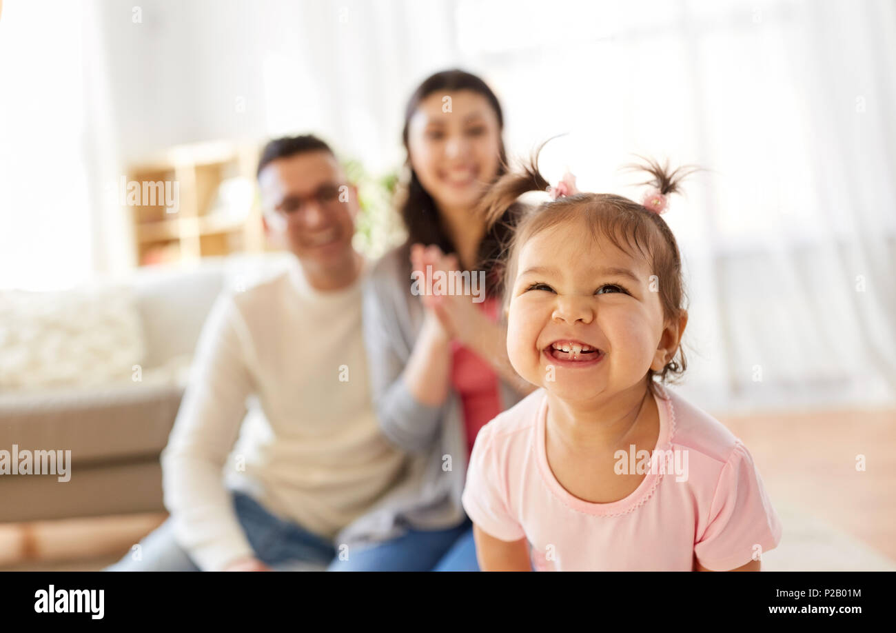 happy baby girl and parents at home Stock Photo