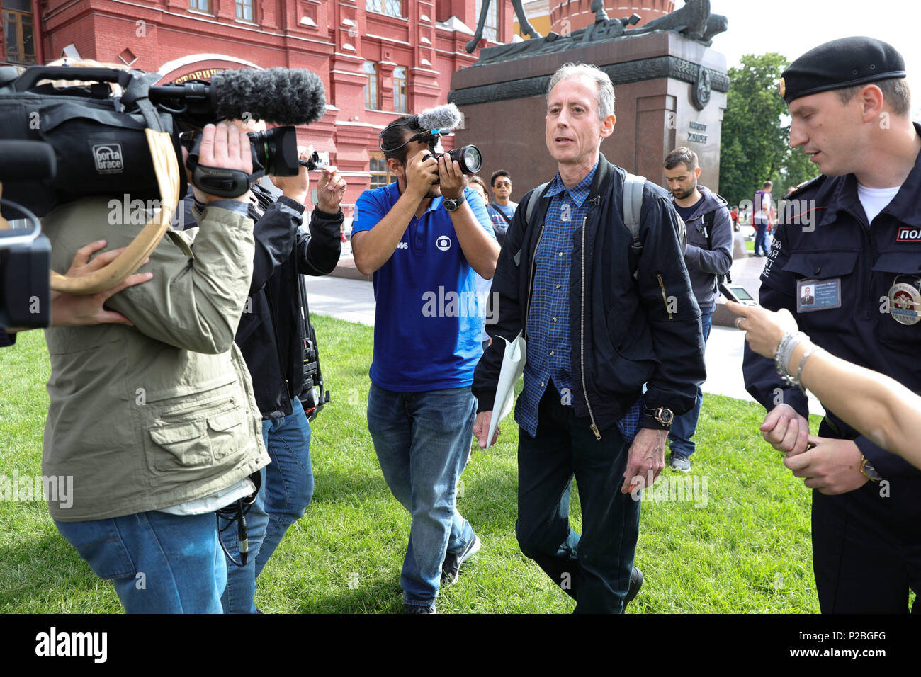 Gay rights campaigner Peter Tatchell is questioned and led away by Russian authorities in Moscow after staging a one-man protest near Red Square. Stock Photo
