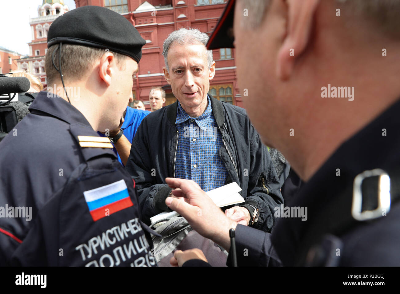 Gay rights campaigner Peter Tatchell is questioned and led away by Russian authorities in Moscow after staging a one-man protest near Red Square. Stock Photo