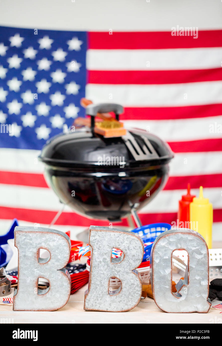 Metal Bbq Sign On Small Round Charcoal Grill With July 4th