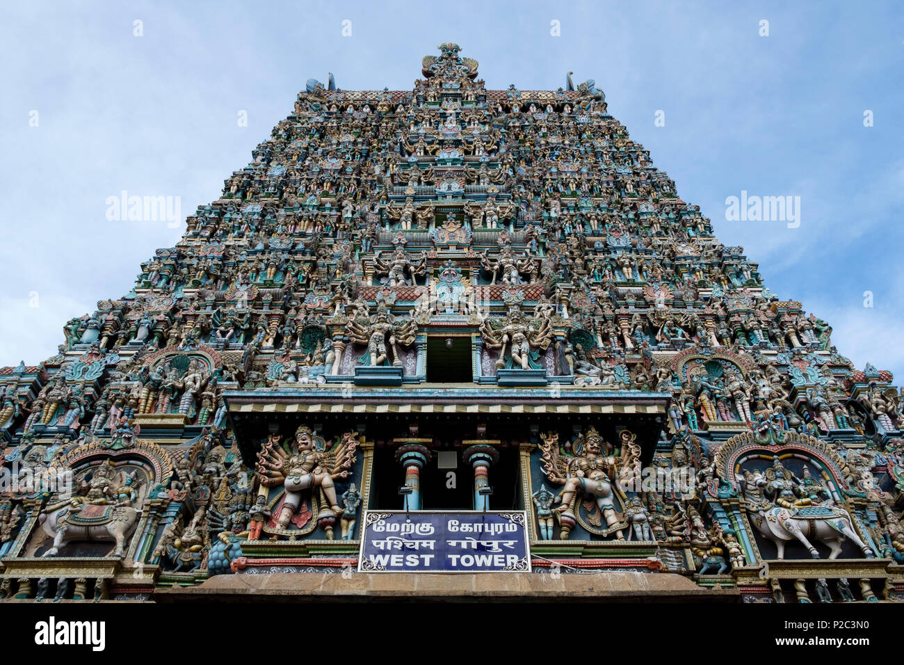 West gopuram (tower), Meenakshi Amman, Hindu temple dedicated to Meenakshi (form of Parvati) and her consort Sundareshwar (Shiva), Madurai, Tamil Nadu Stock Photo