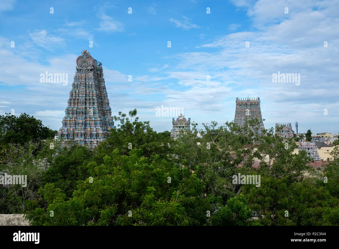 Several of the fourteen 'gopuram' (gateway towers) of Meenakshi Amman Temple, Madurai, Tamil Nadu, India. Stock Photo